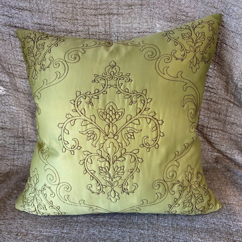 Light green with yellowish tinge toss pillow.